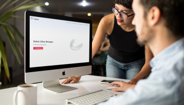 girl-showing-something-in-imac-mockup-to-coworker-a16266